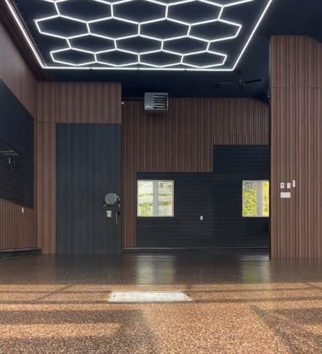 Copper flake garage floor under hex lighting