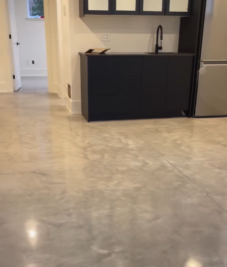 Cream metallic basement floor with wet bar