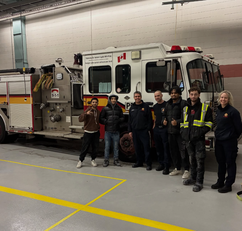 The Floor Company crew with Ottawa firefighters at a fire station after a floor coating install