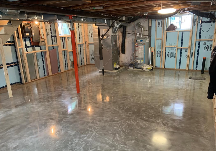 Metallic epoxy basement floor with silver swirl and high gloss
